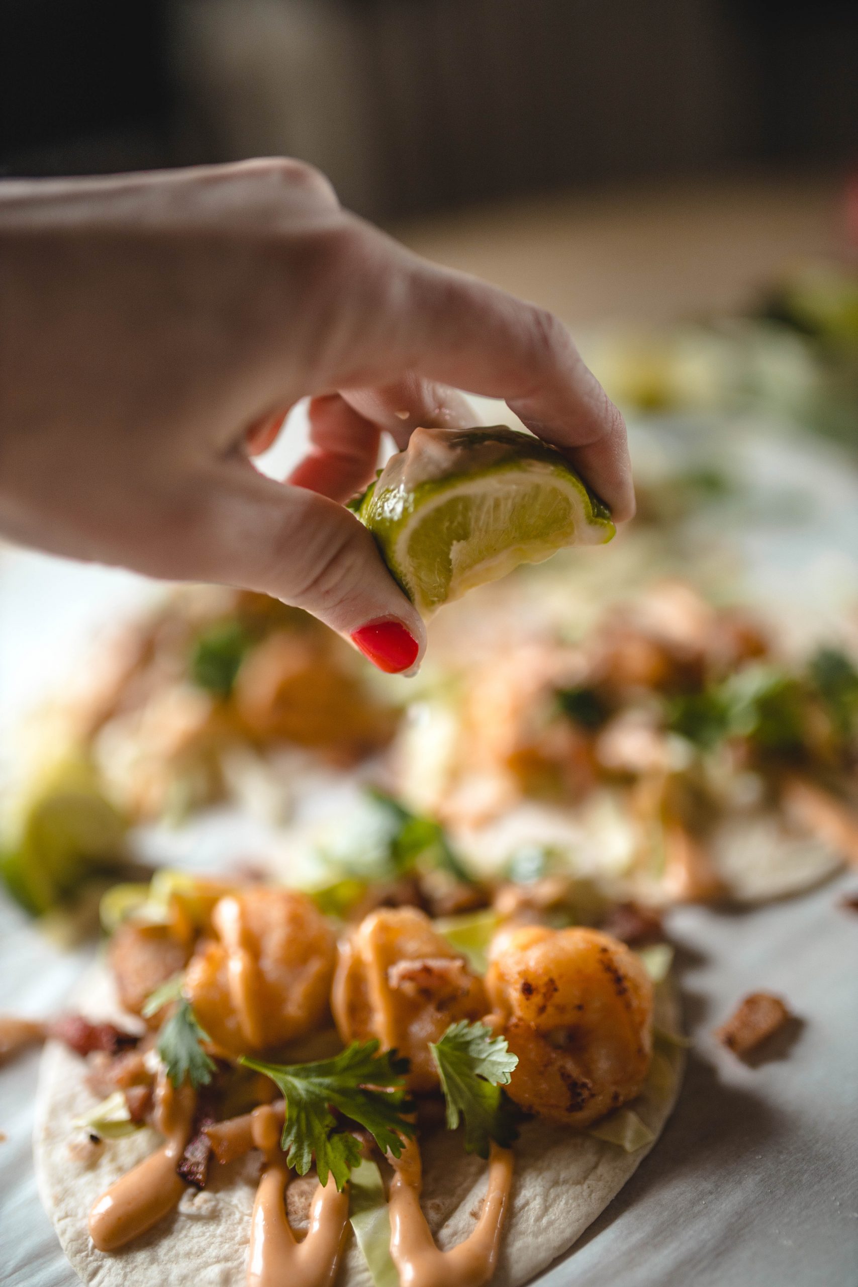 A squeeze of lime to finish off the perfect shrimp taco 