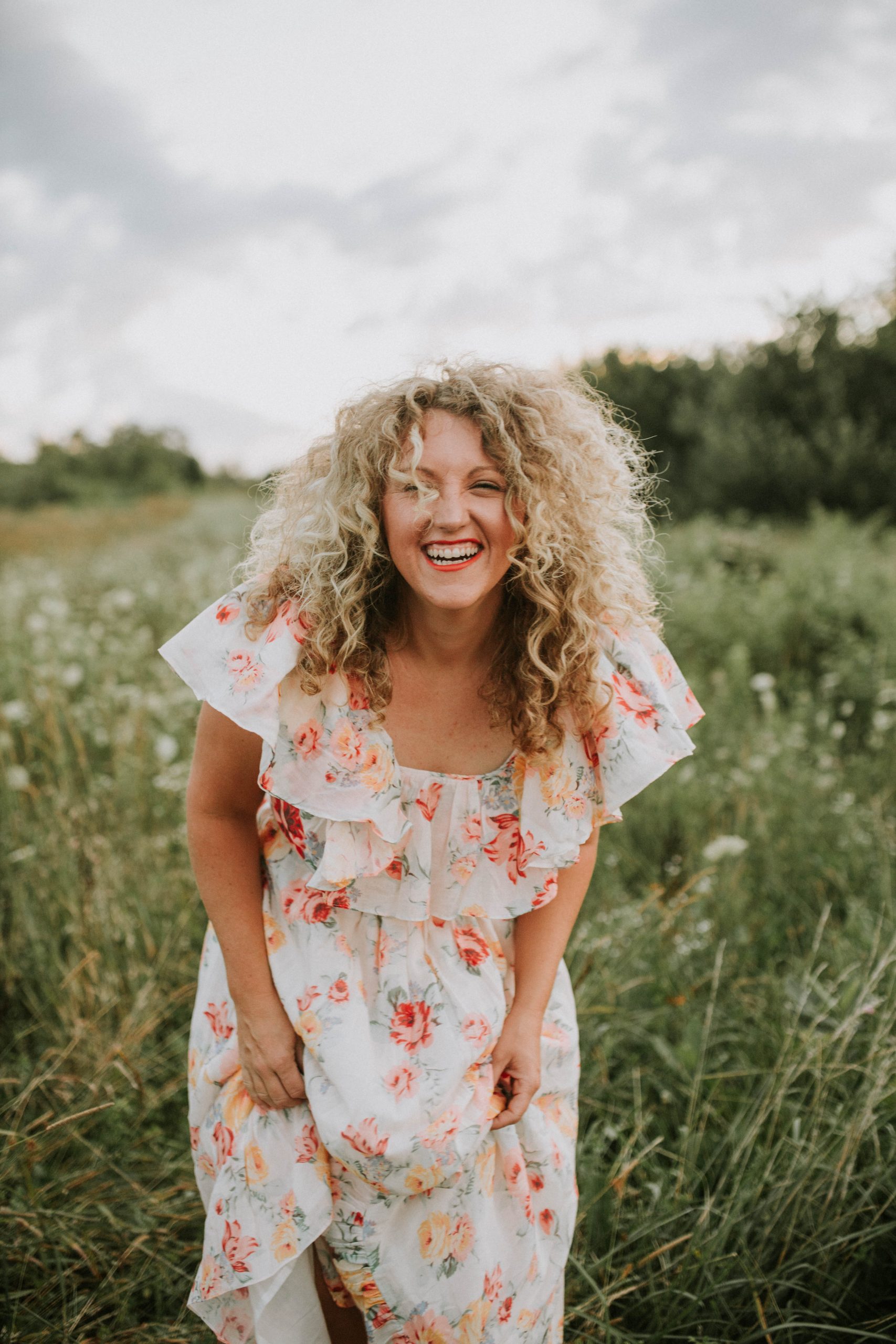 Laughing Curly Hair in a Field