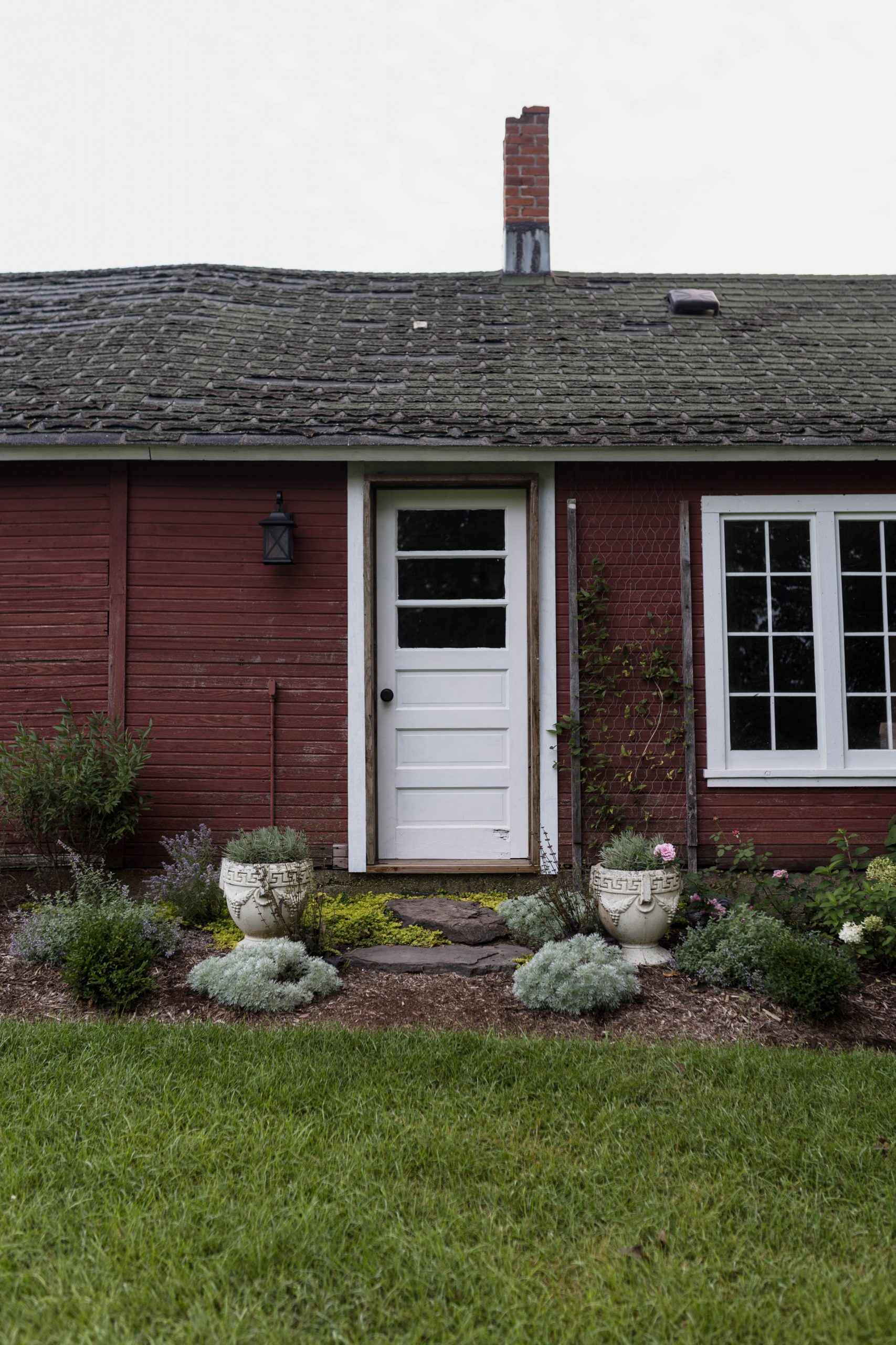 Vintage decorated historic Michigan Farm with cement urns